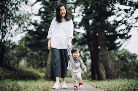 mum walking with baby mum walking with baby
