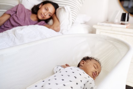 mum watching baby sleep