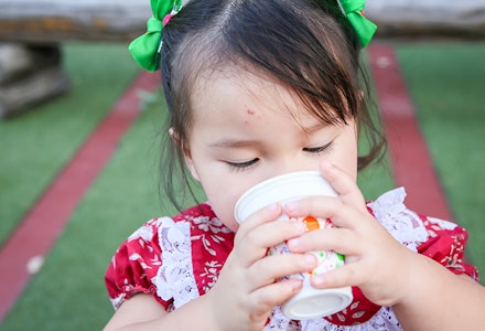 toddler drinking from cup