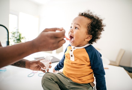 toddler eating yoghurt