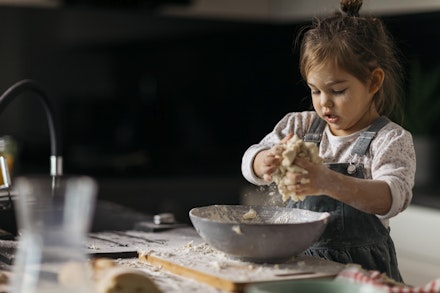 toddler playing with dough