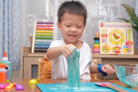 toddler playing with slime