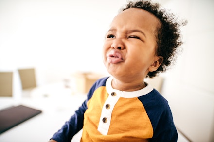 toddler screwing up face
