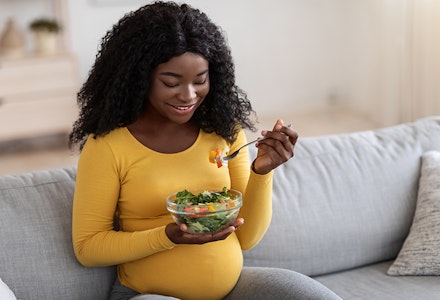 woman eating salad
