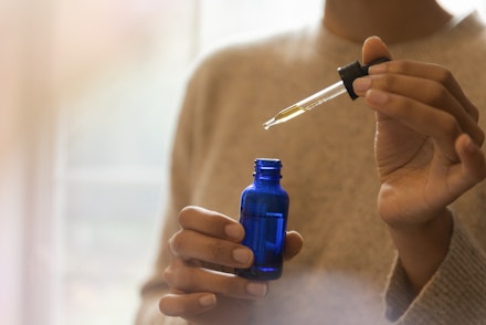 woman using essential oils