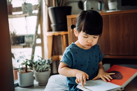 young girl reading book