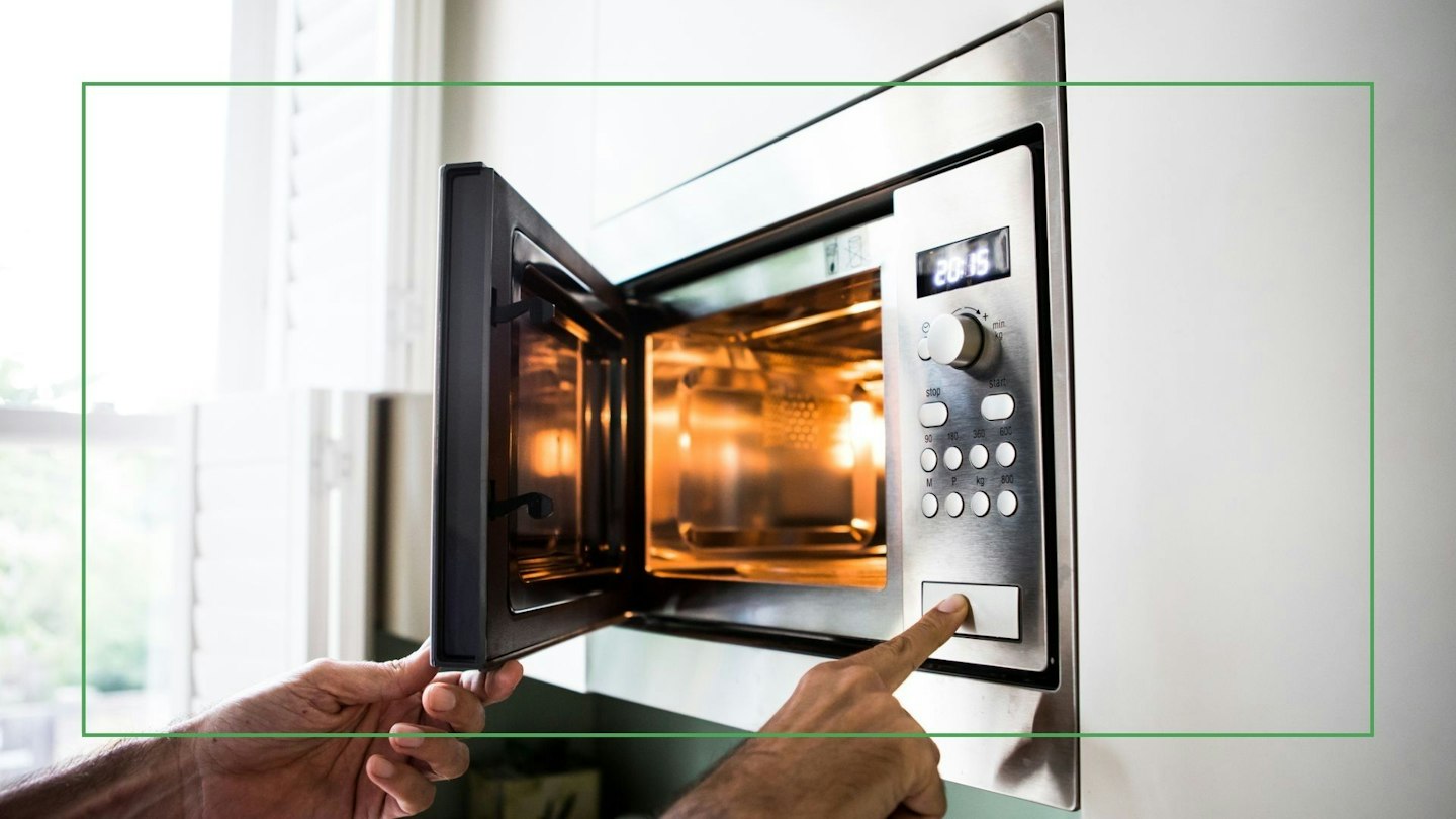 Human Using Microwave The Best Microwave To Make Cooking Simple