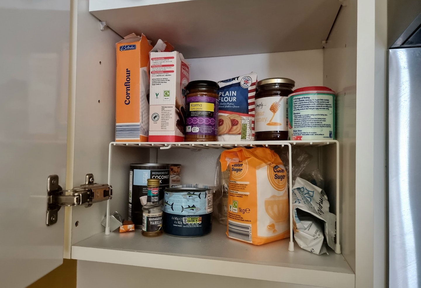 kitchen cupboard with two tier organiser