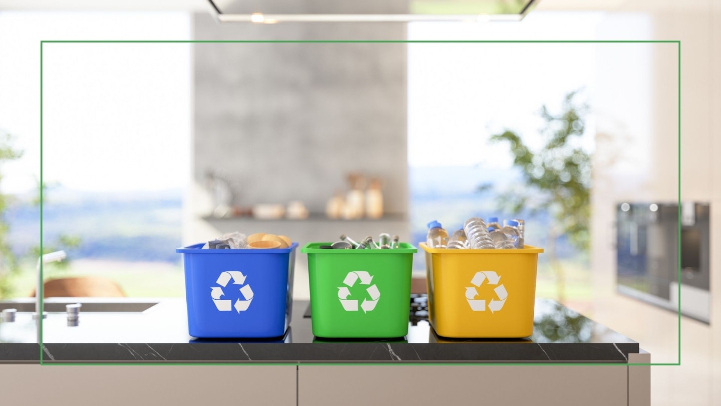 Three recycling bins in the kitchen