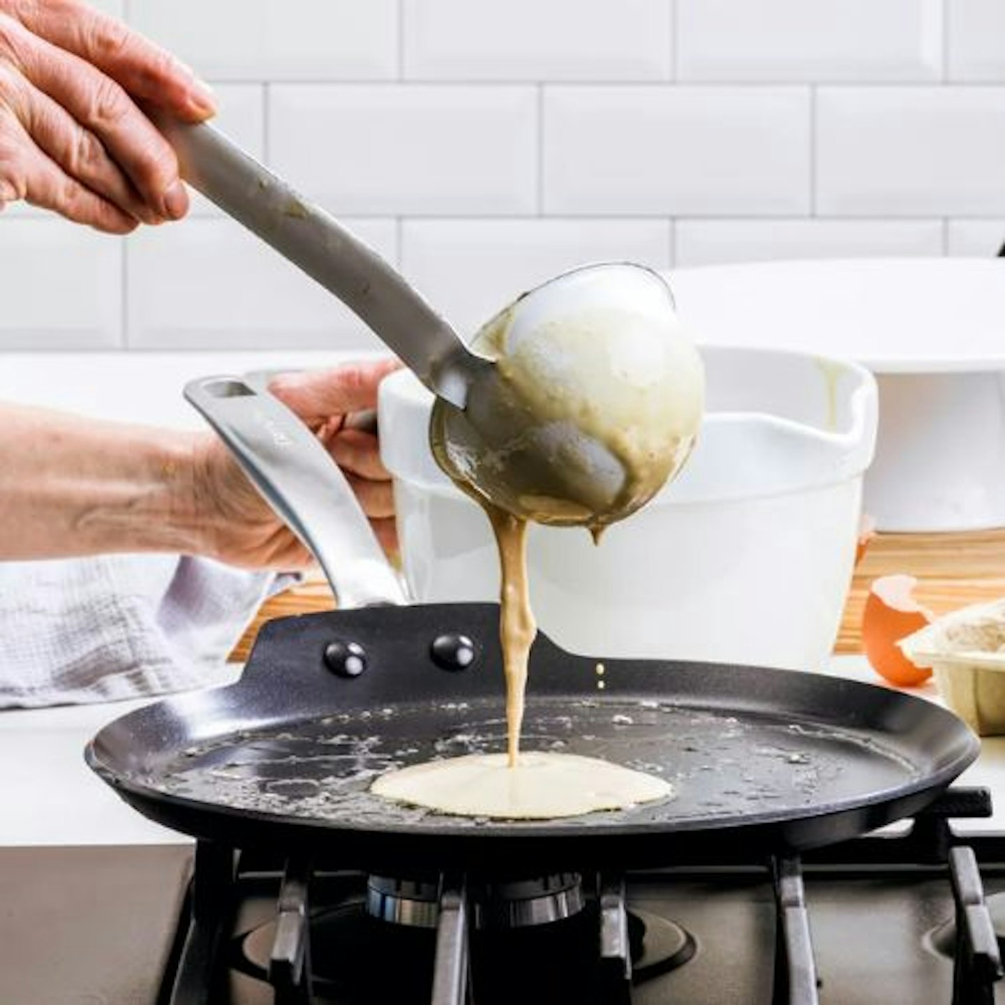 https://images.bauerhosting.com/affiliates/sites/10/2023/02/GreenPan-Copenhagen-Hard-Anodised-Ceramic-Non-Stick-Pancake-Pan-28cm.jpg?auto=format&w=1440&q=80