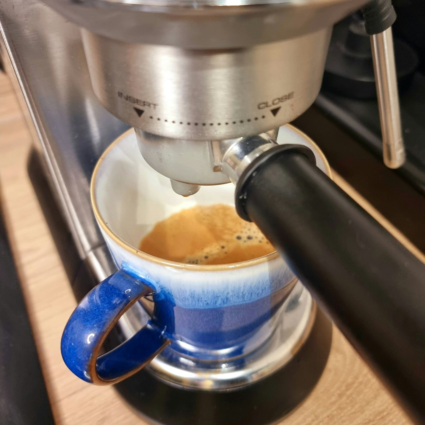 Close up of freshly brew coffee Delonghi Dedica Arte Espresso Maker
