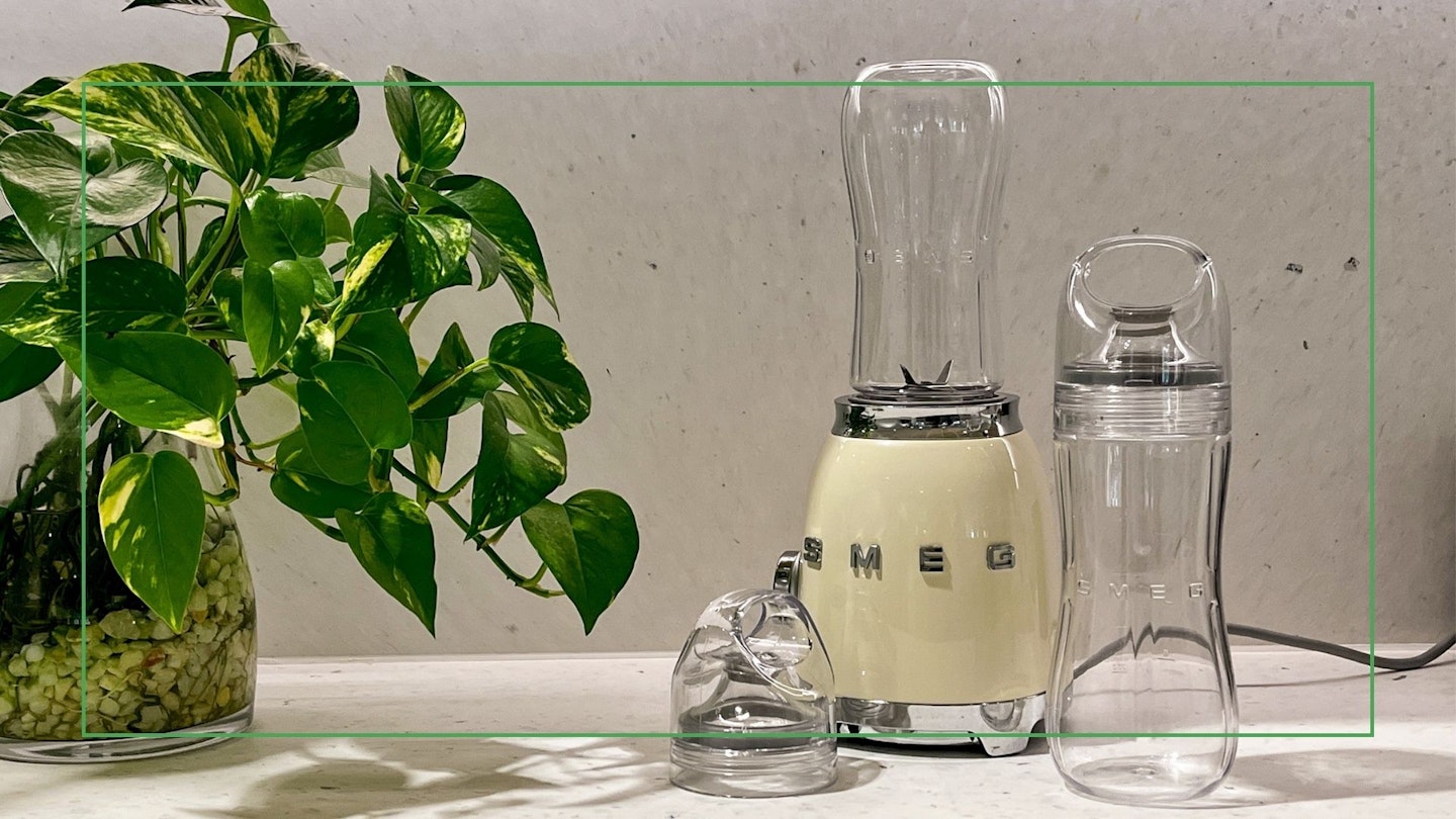 The Smeg personal blender next to a potted plant