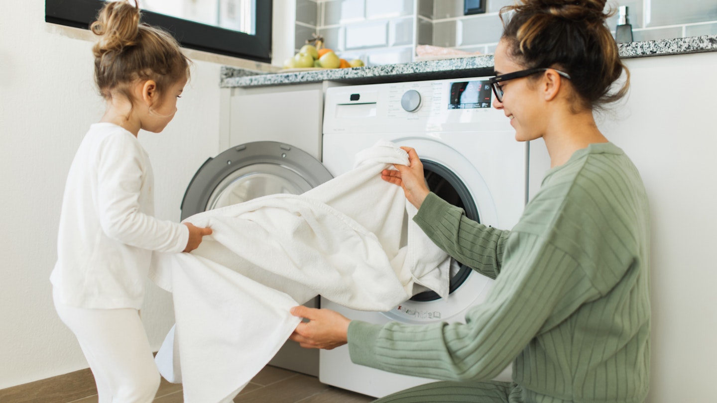 Family with tumble dryer