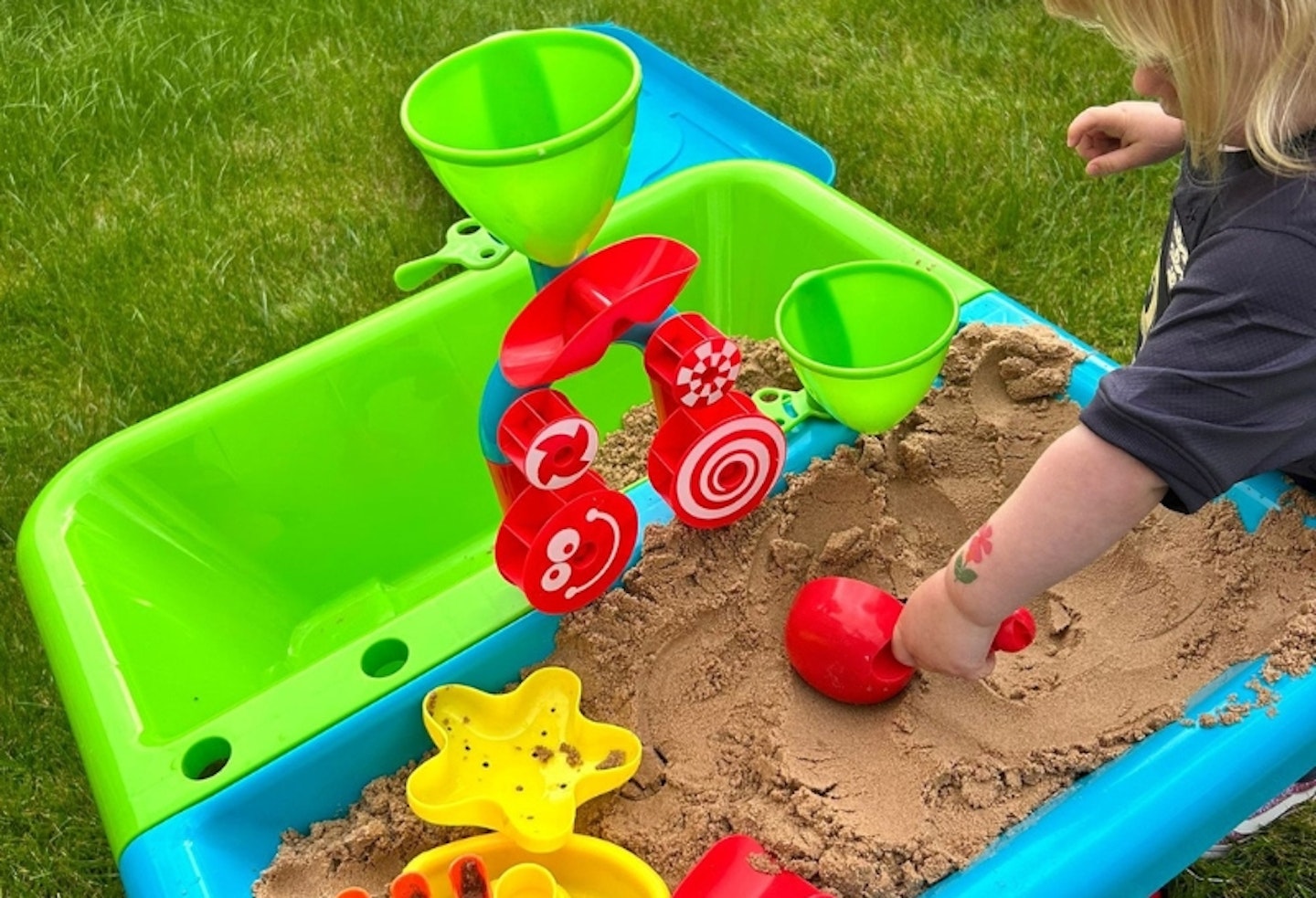 Early Learning Centre Sand and Water Table outside with the sand in the right hand side