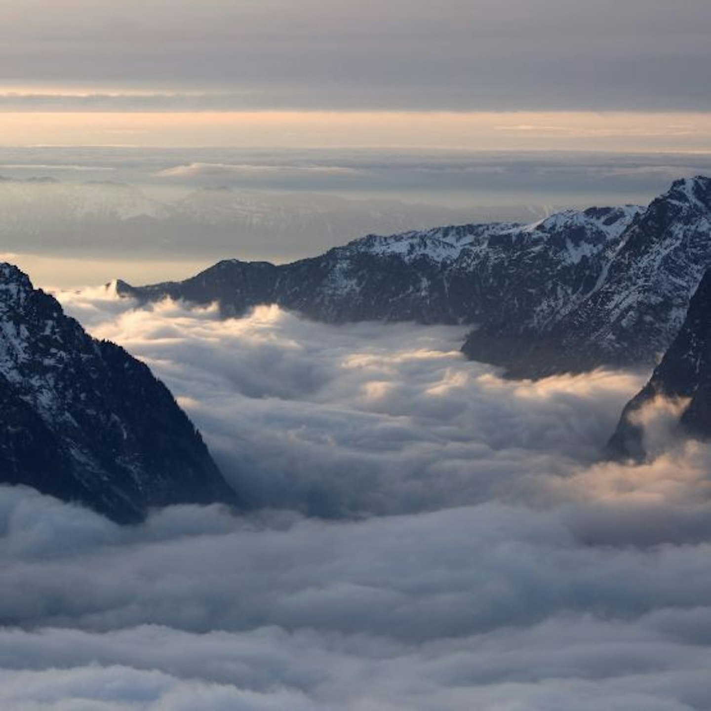 A mountain valley covered in mist