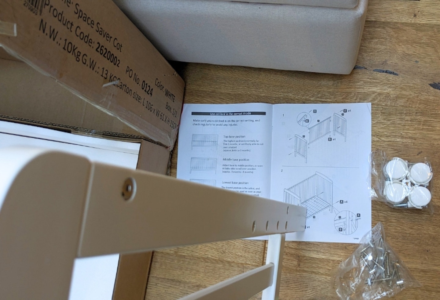 Babymore Space Saver cot being unpacked and assembled