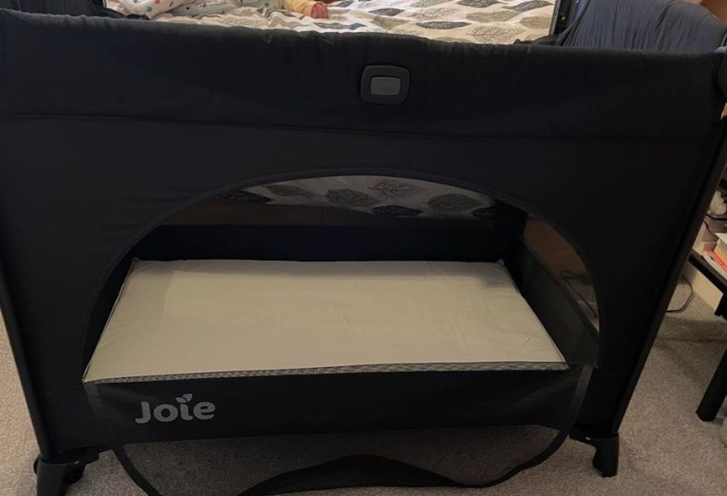 The outside view of the Joie Kubbie travel cot