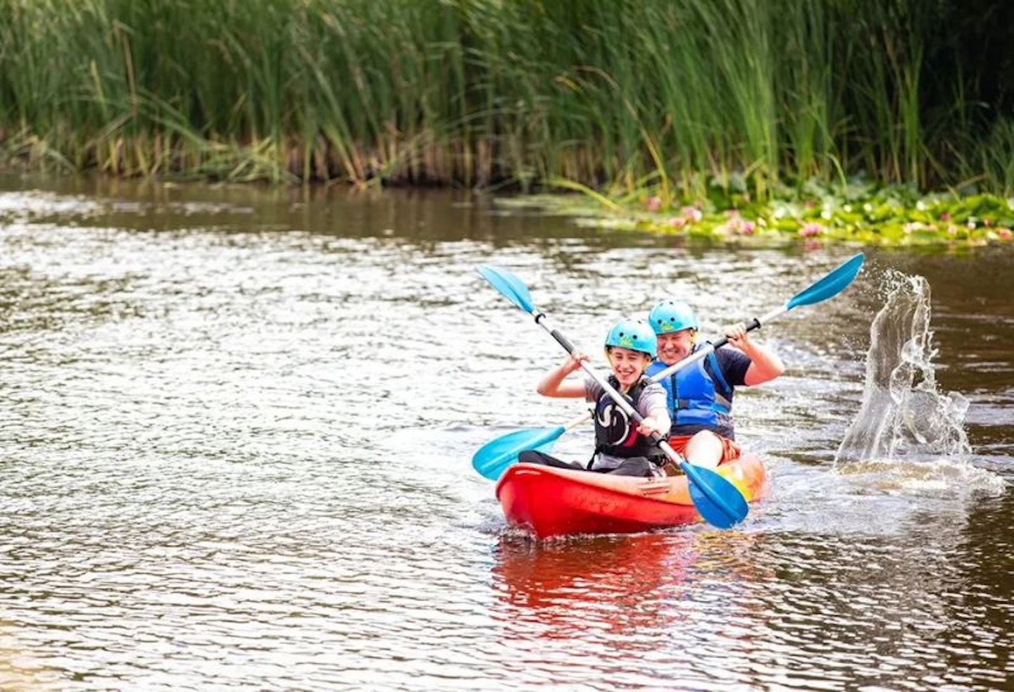 A father and son kayaking at Bluestone National Park Resort