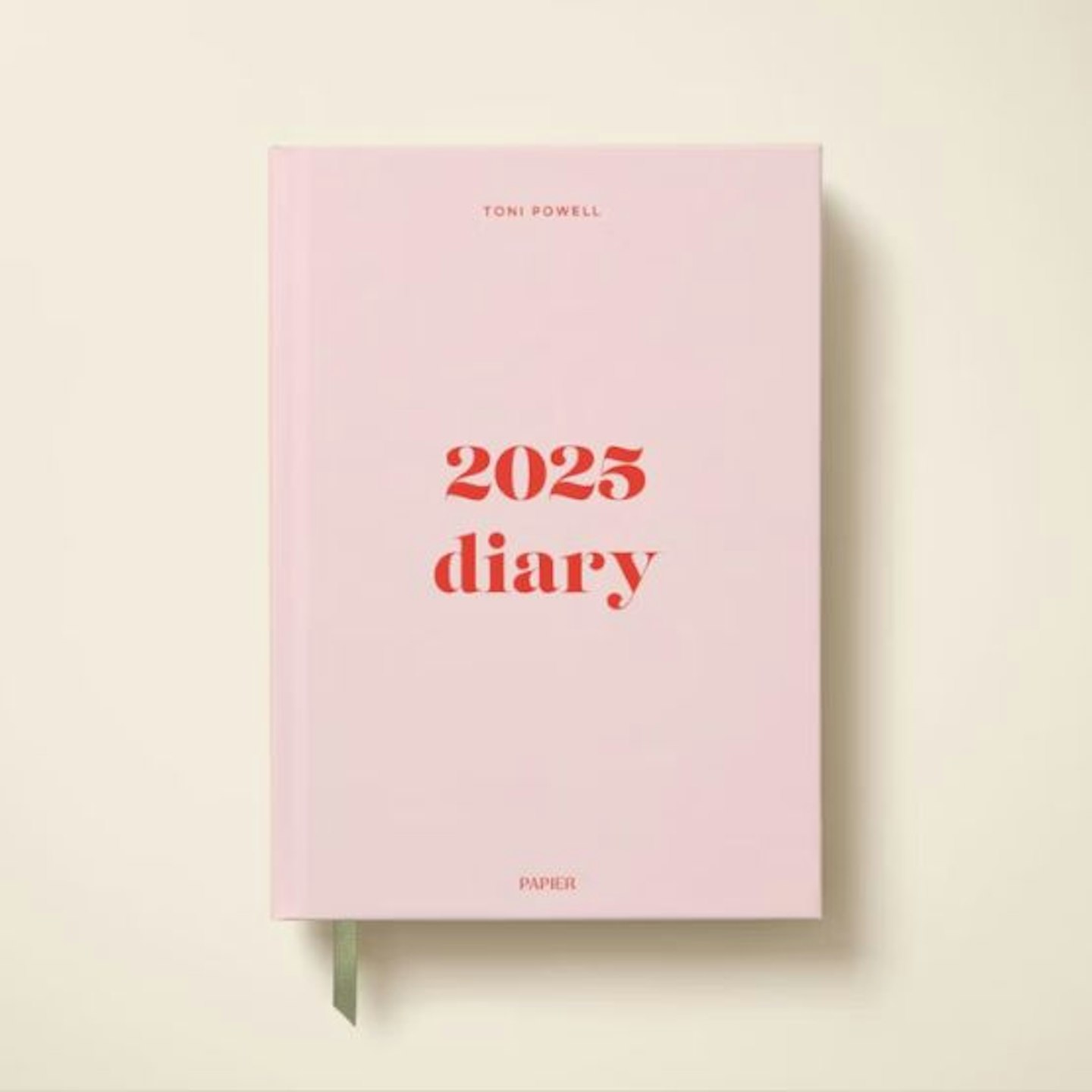 A pink dairy with 2025 Diary written on in red letters
