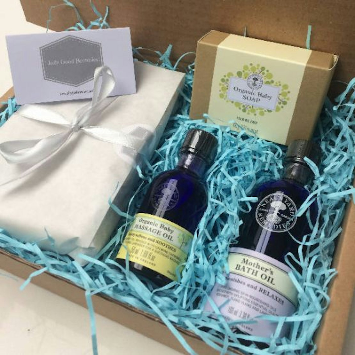 An image of a gift box containing Neals yard products and a batch of brownies