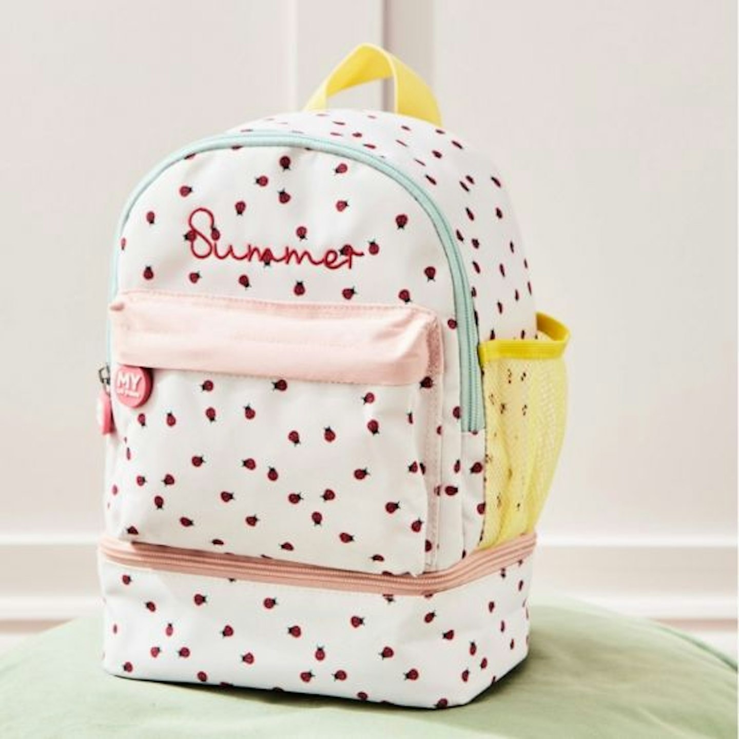 Personalised Ladybird Mini Compartment Backpack with ladybirds, yellow side pocket and a zip compartment at the bottom