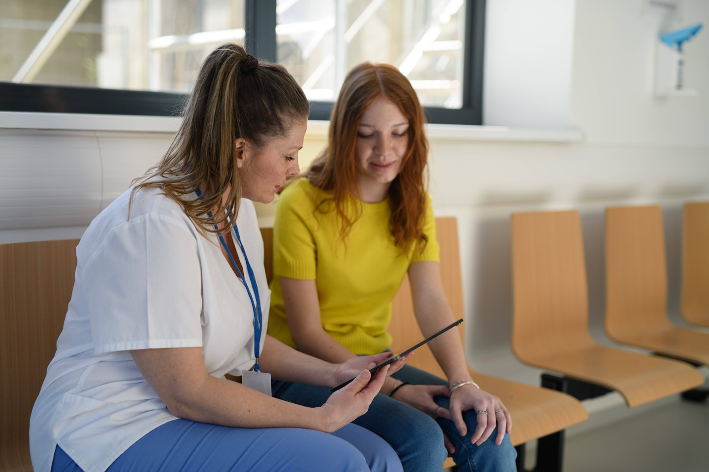 Nurse talking to woman