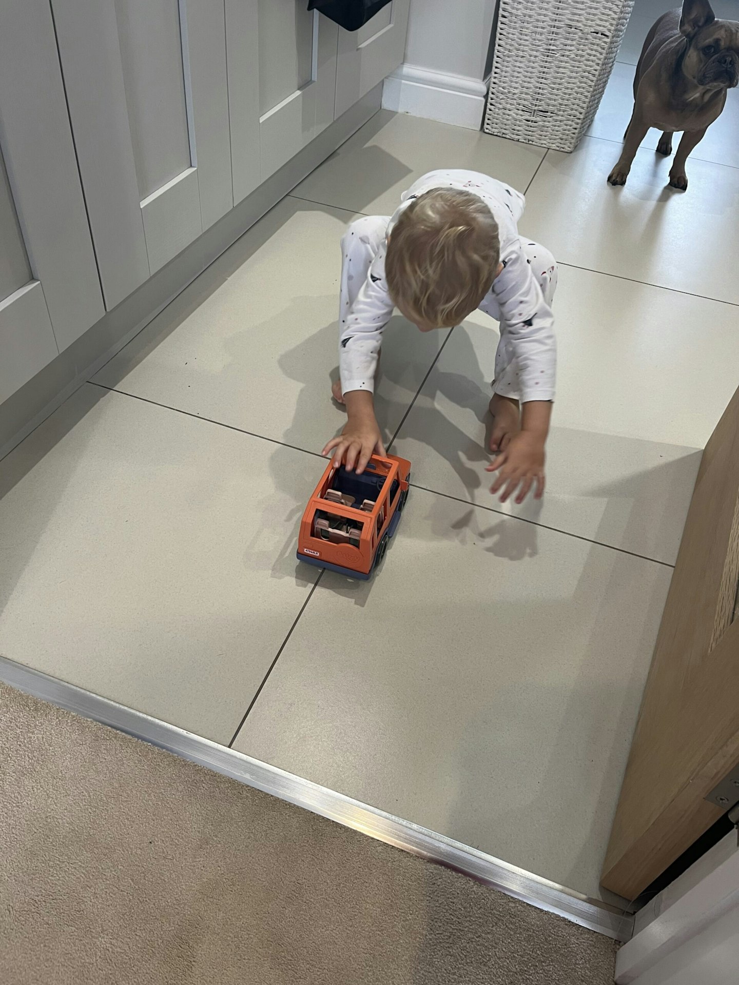 Child playing with 4WD Bluey truck