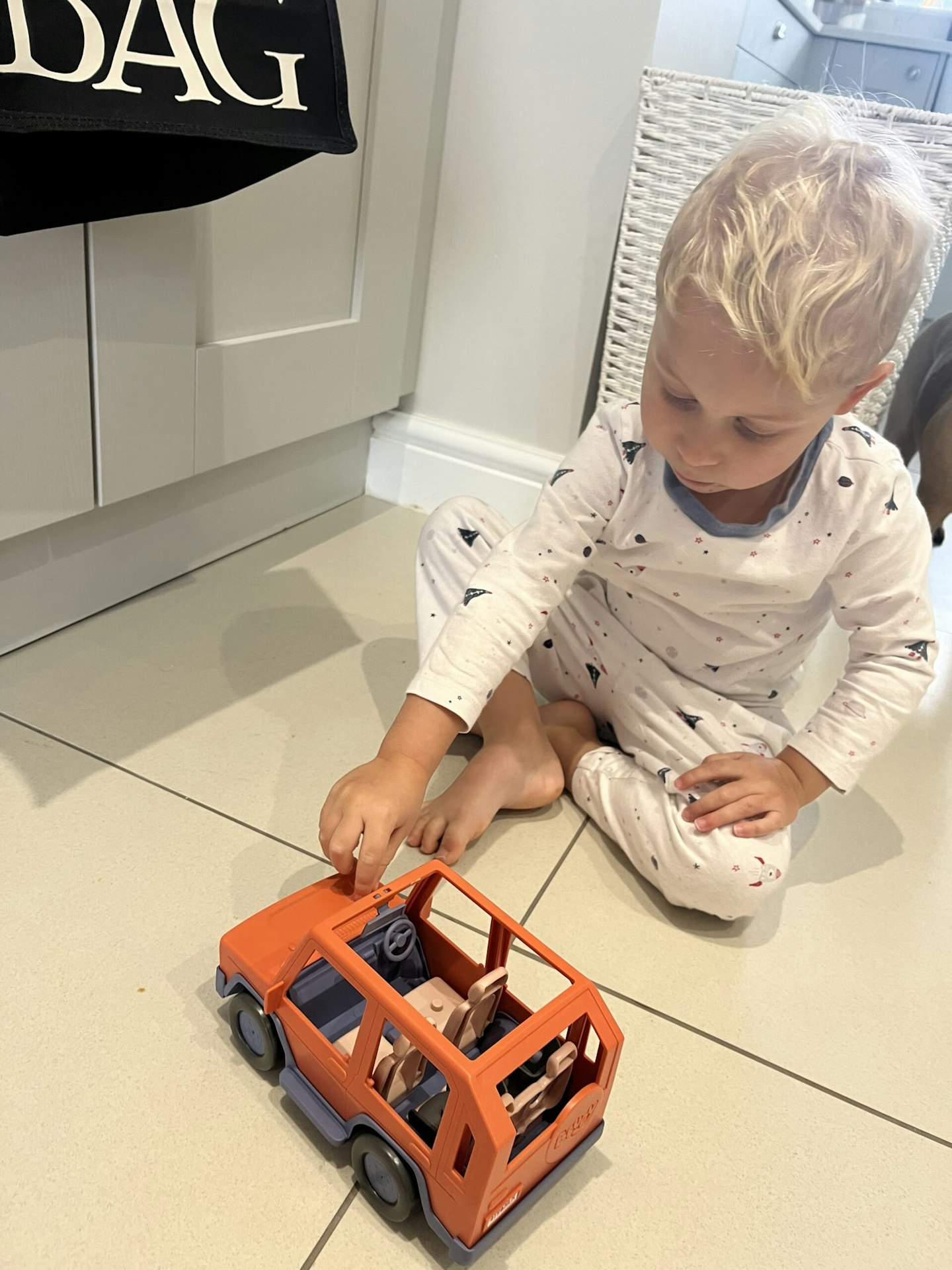 Child playing with 4WD Bluey truck