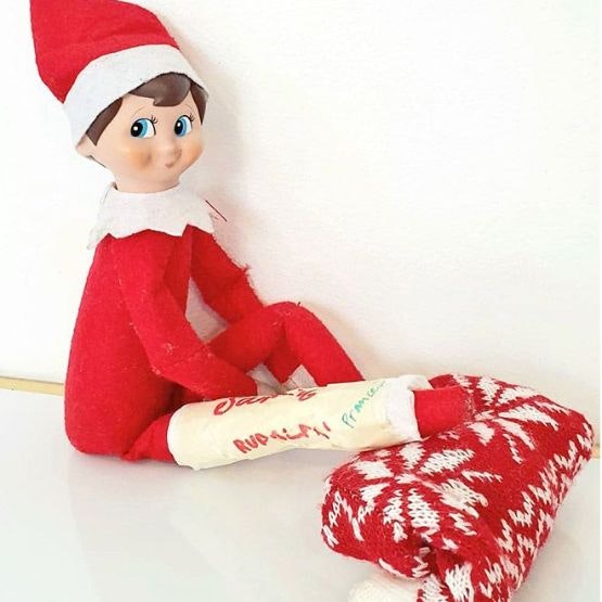 An elf with his leg wrapped in masking tape as a cast