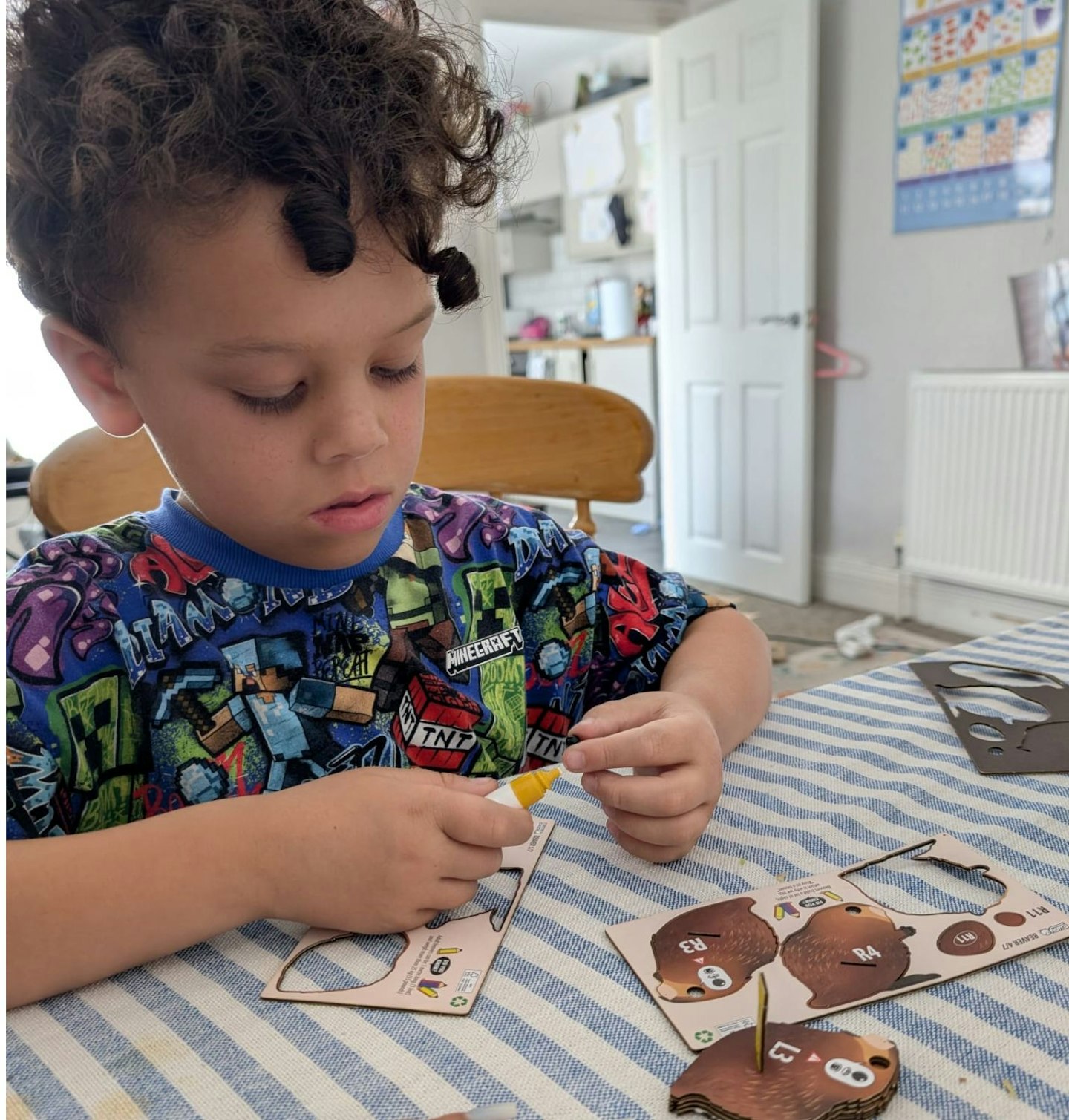 Geroge playing with EUGY Beaver 3D Model Craft Kit