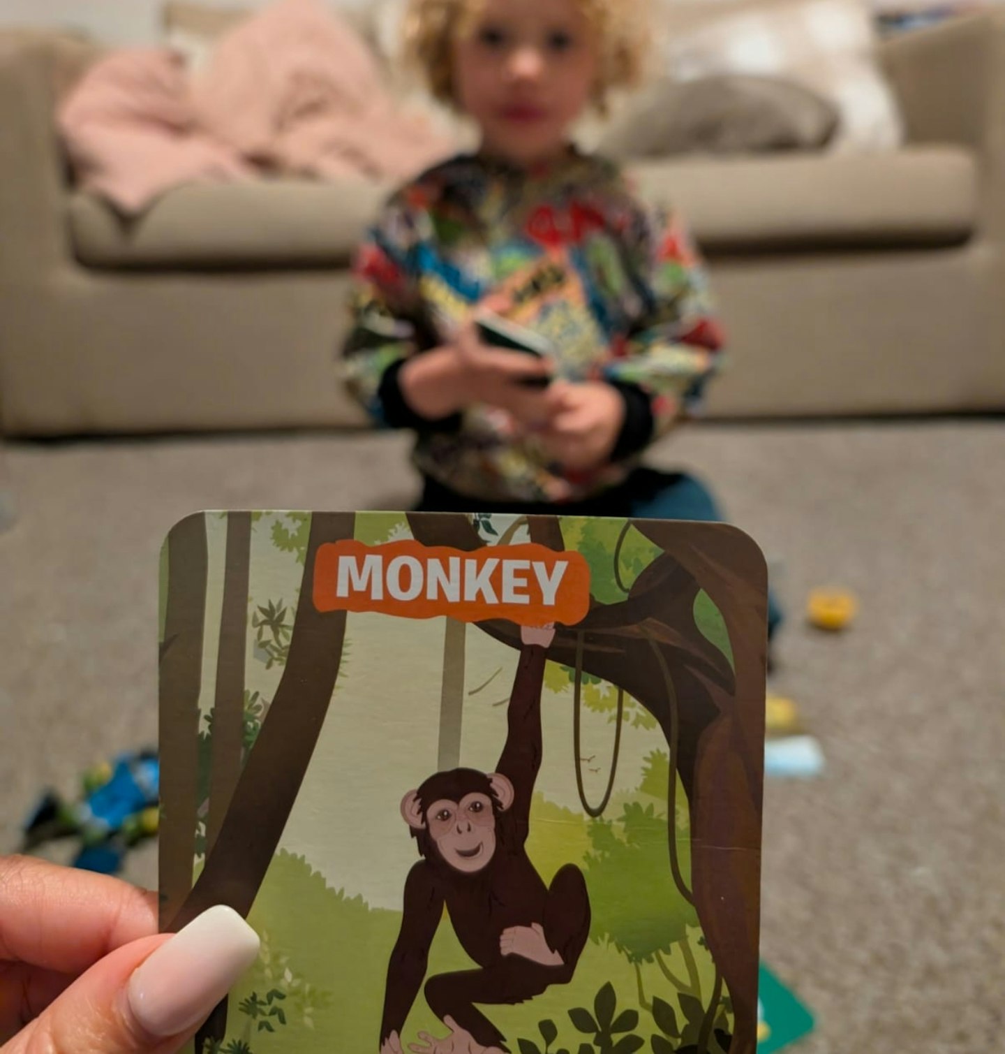 Senior Writer Hannah Carroll playing Guess in 10 Animals with her child.