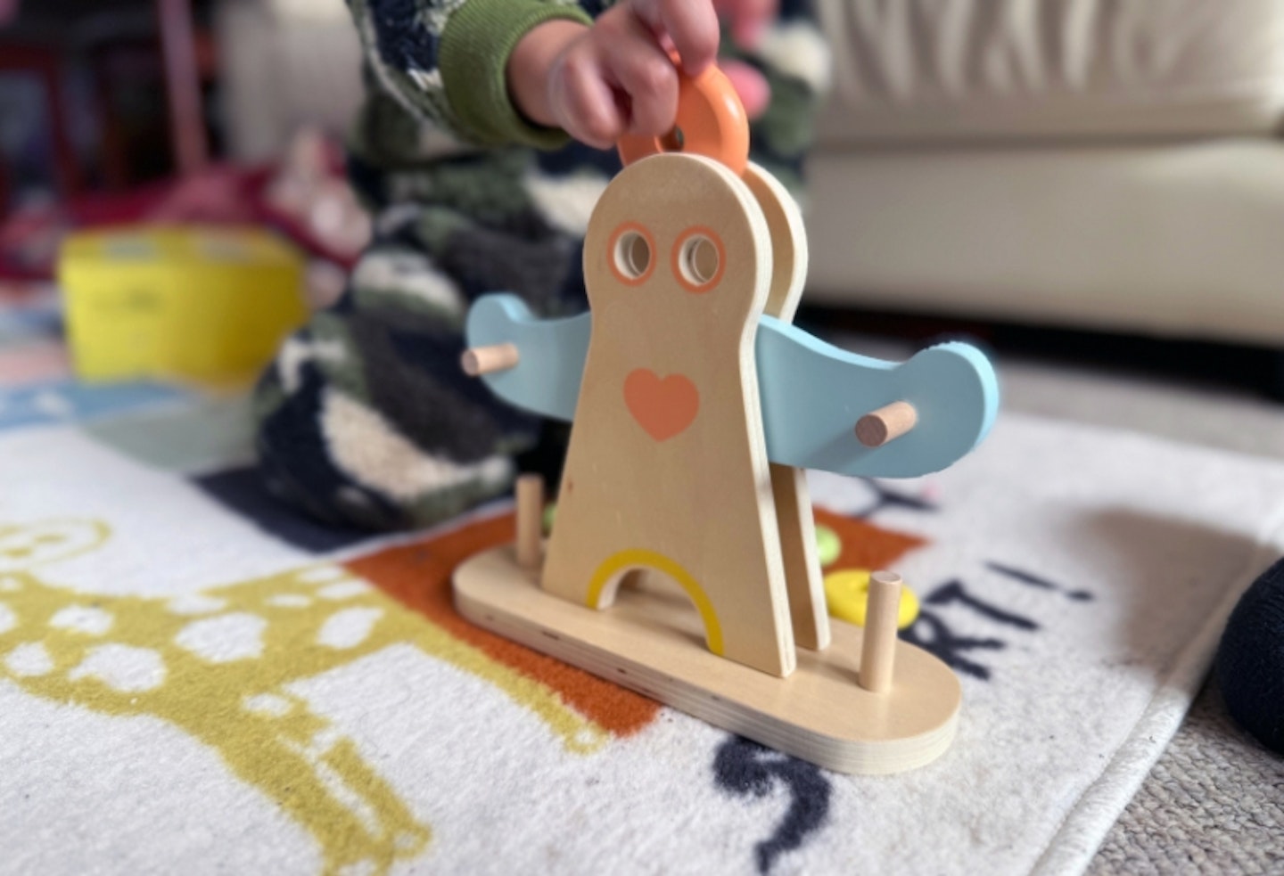 young boy playing with the Hippychick Classic World Hercules Weightlifting toy
