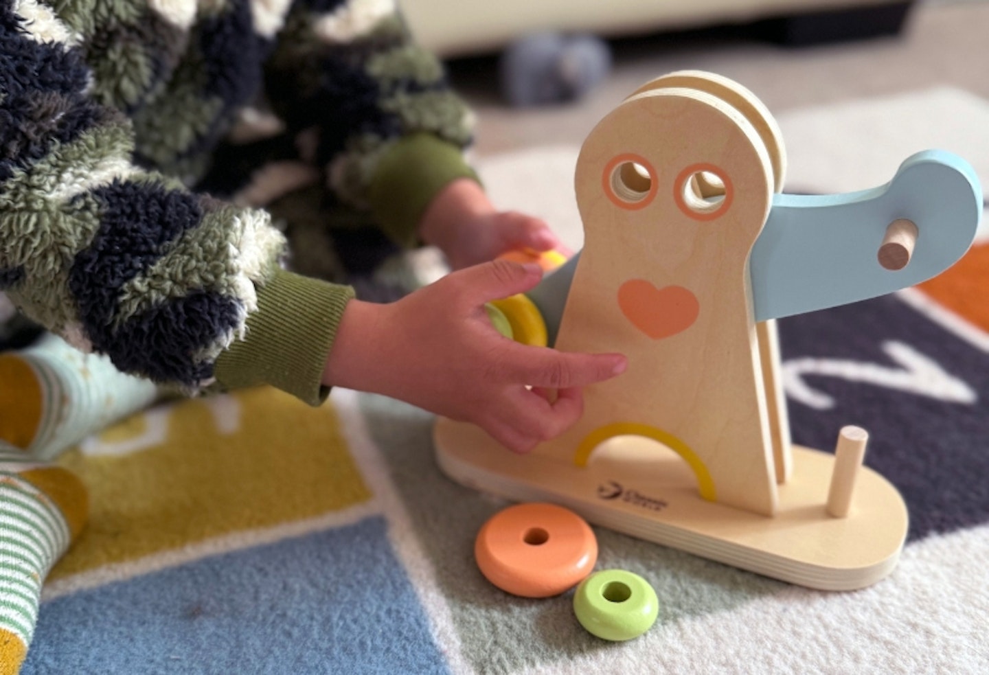 young boy playing with the Hippychick Classic World Hercules Weightlifting toy
