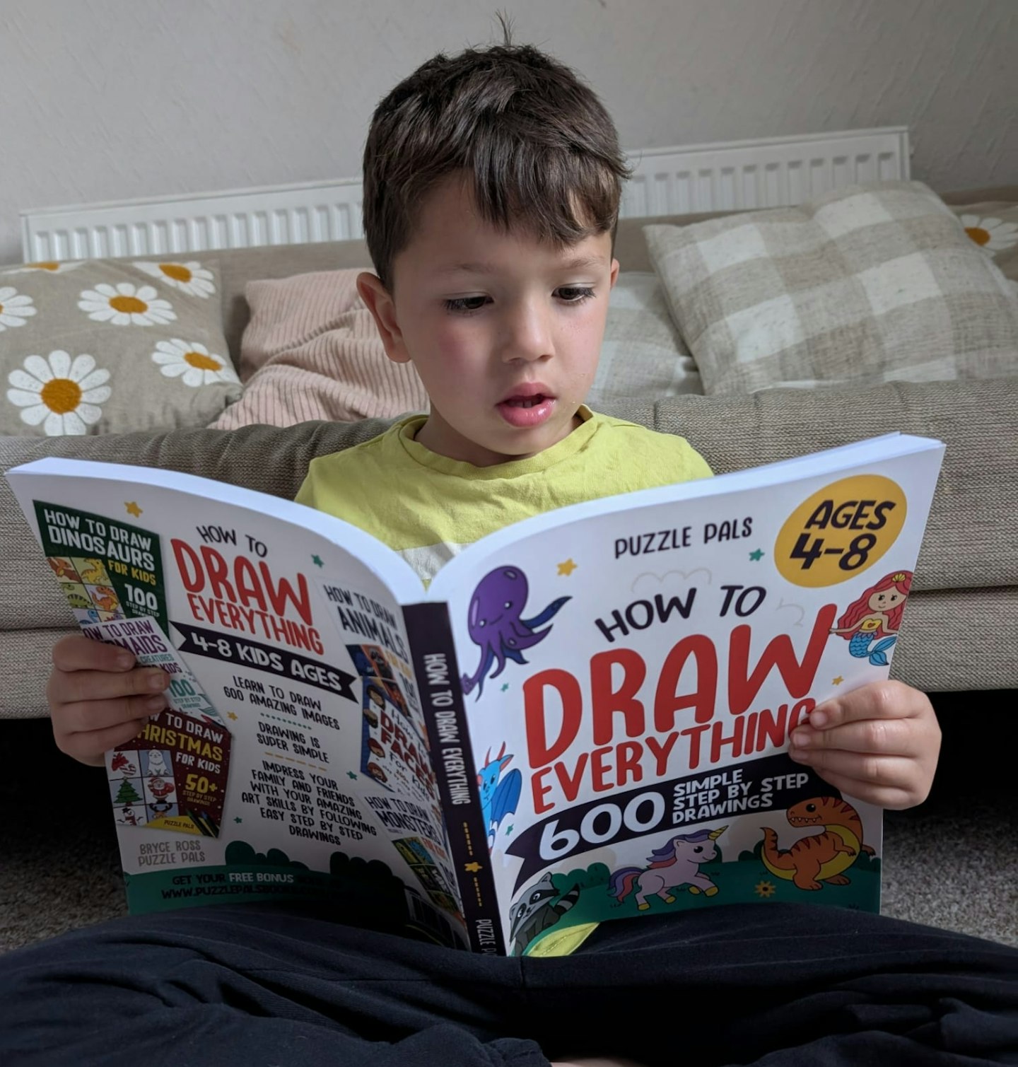 5 year old Frank reading How To Draw Everything