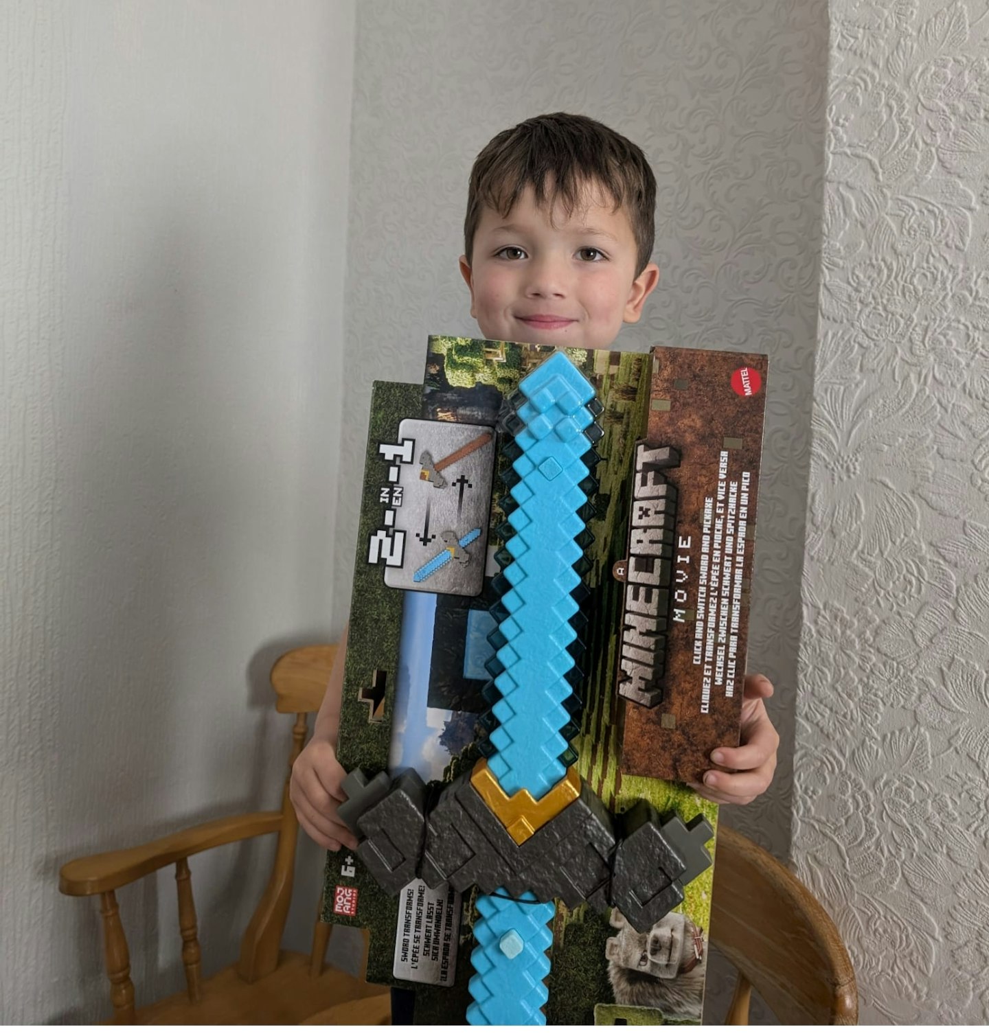 Frank James stood proudly with his Mattel Minecraft Sword and Pickaxe 2-in-1 Toy