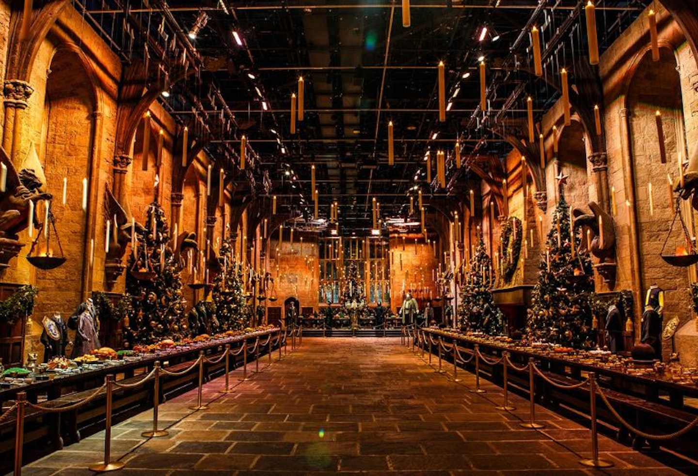 The Great Hall at Hogwarts, lit up with candles at Christmas