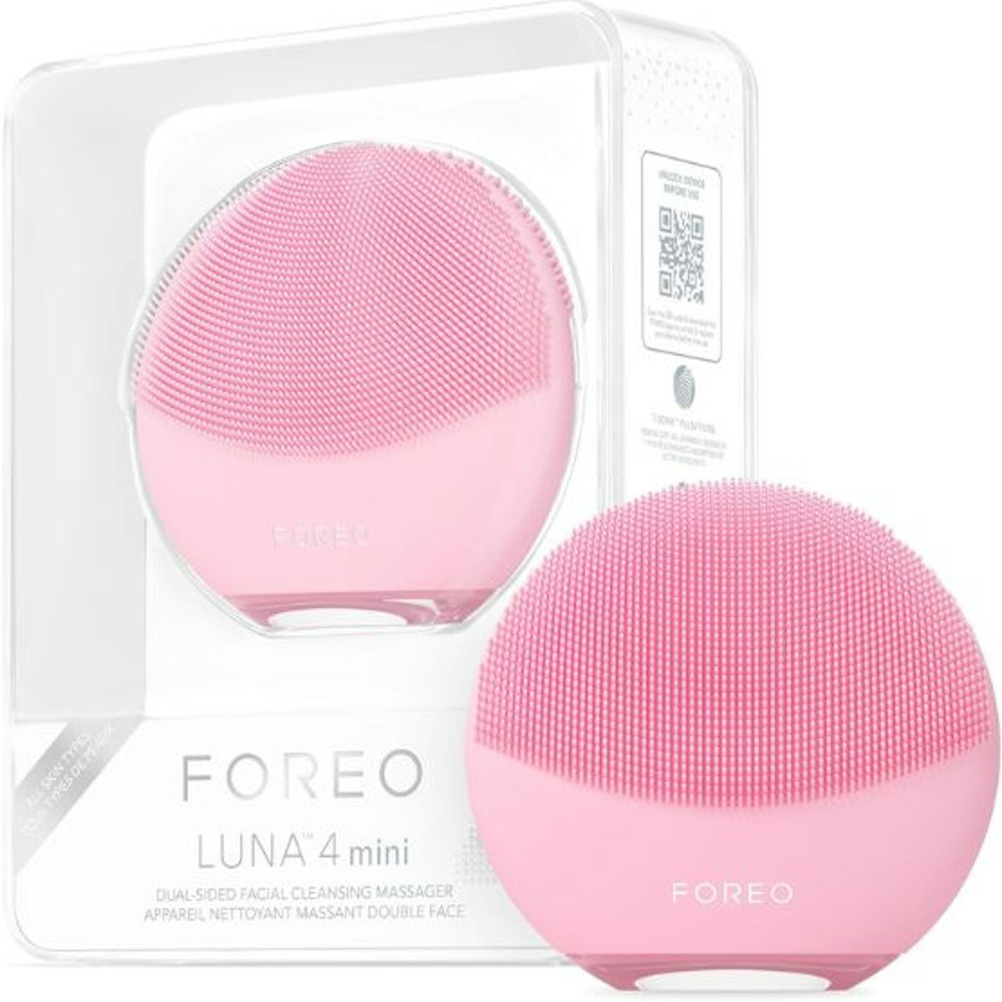 Two pink Foreo face cleansing devices