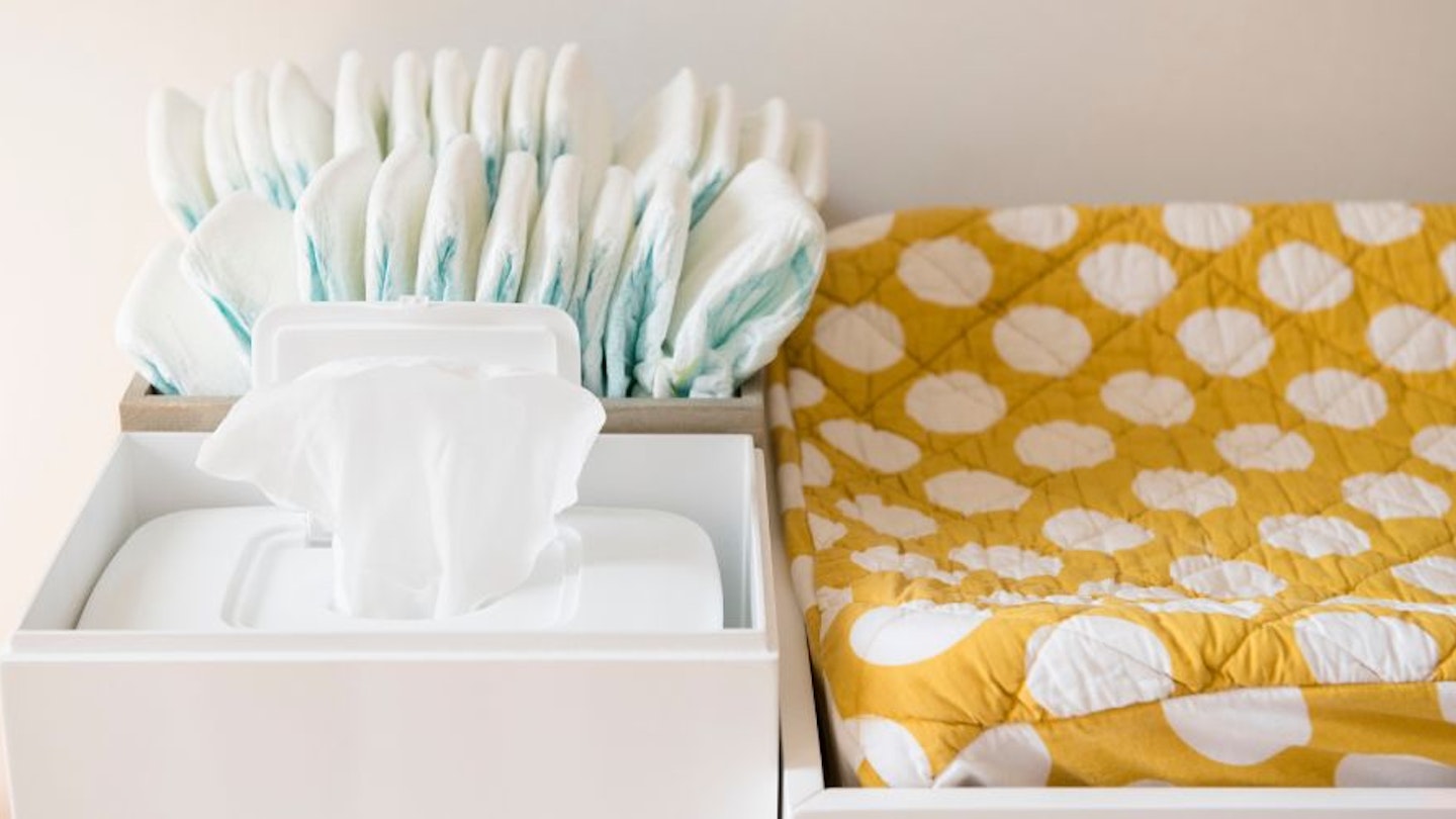 A close up of baby wipes on a changing table