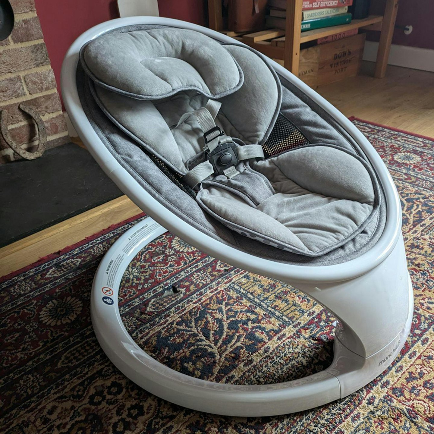 Munchkin Bluetooth Enabled Lightweight Baby Swing on floor