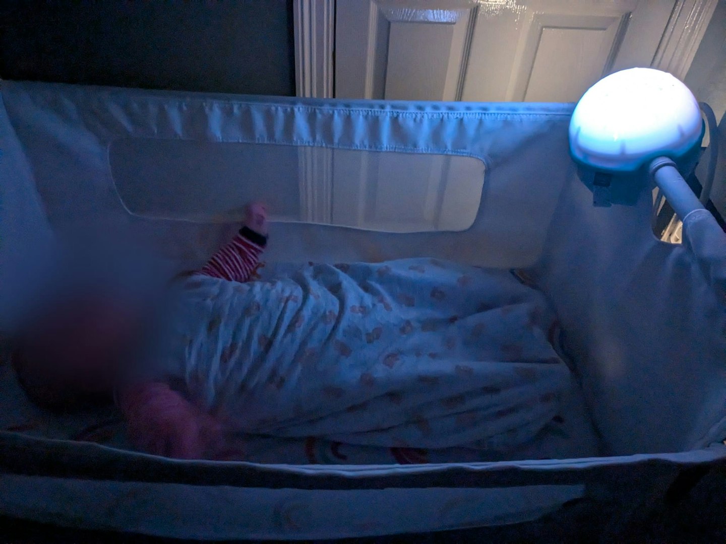 Chicco Next2 Stars Night Light Projector on crib at night