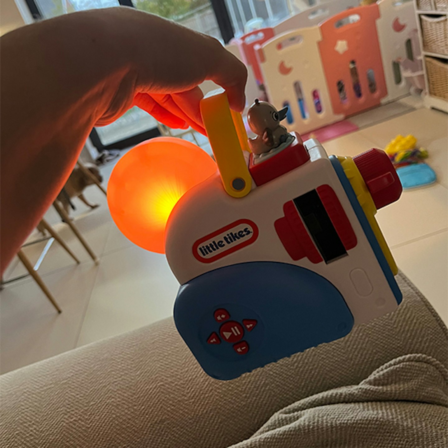 Mum holidng Little Tikes projector