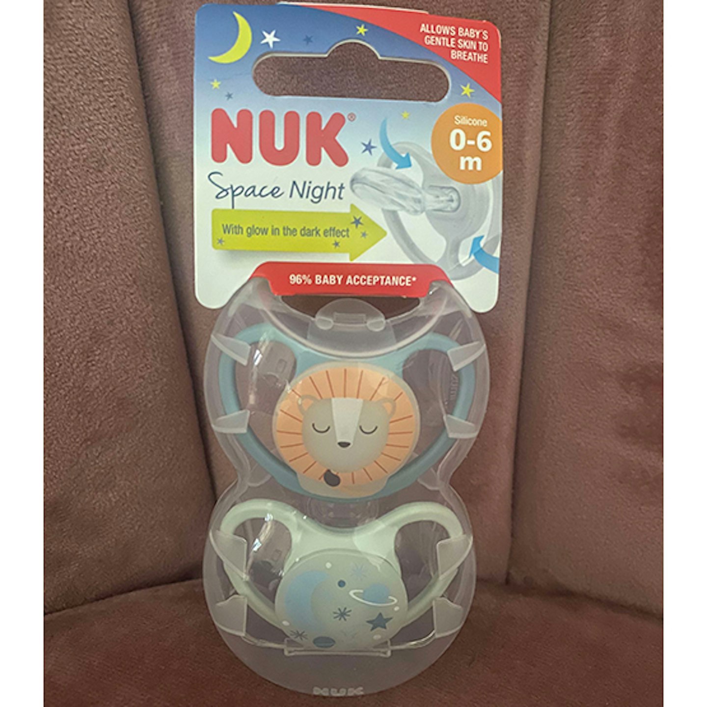 Nuk Space night dummies with space print on pink chair