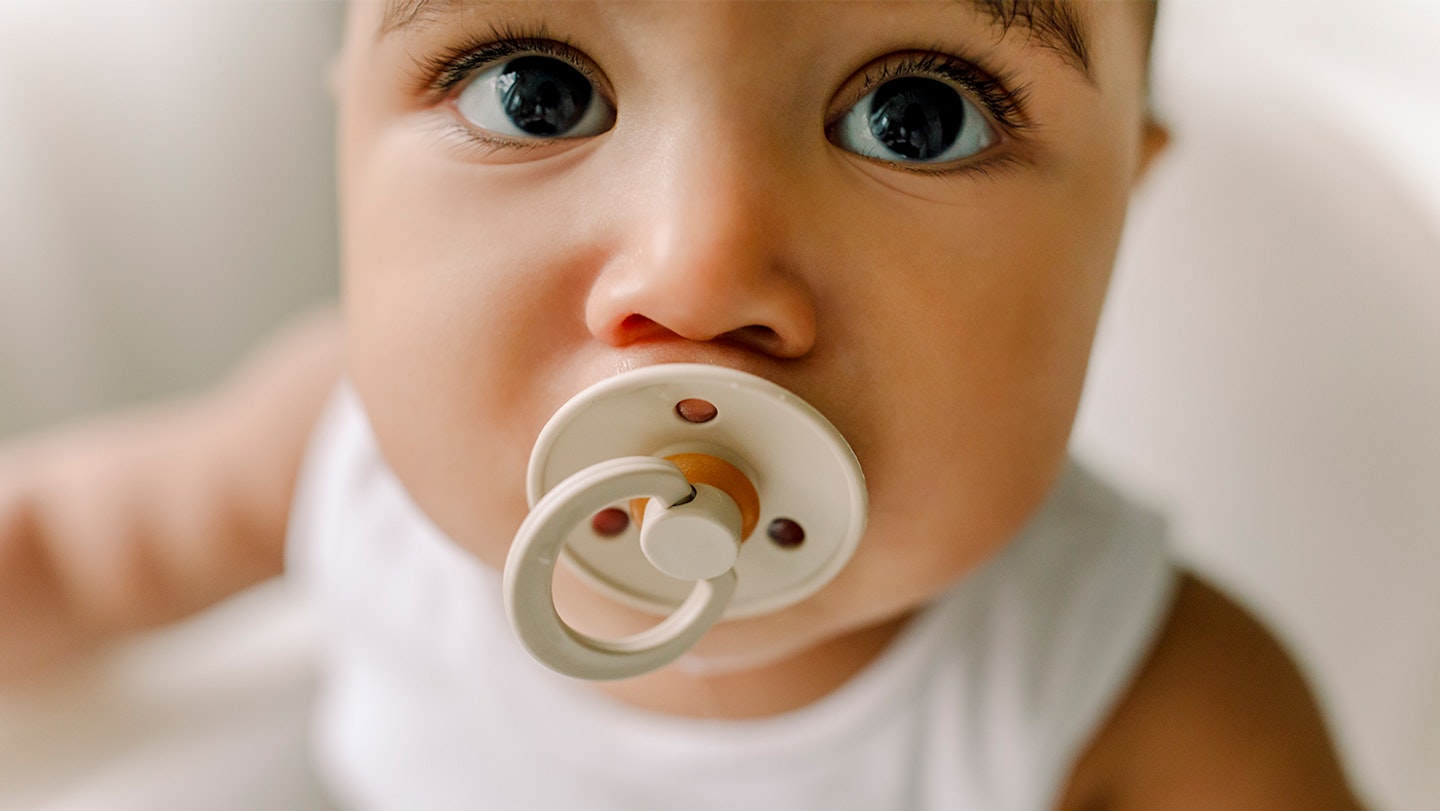 baby with dummy in mouth
