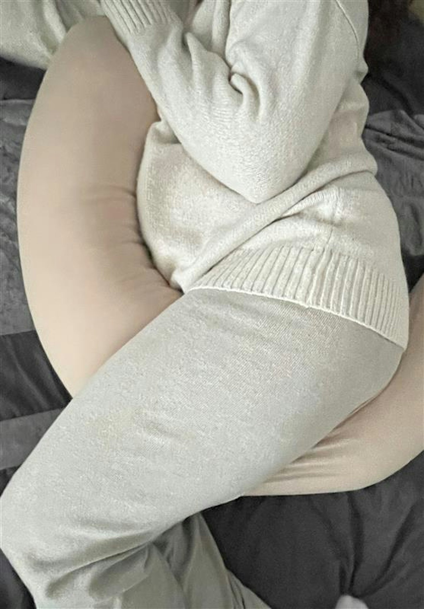 The Najell pregnancy pillow being tested by a pregnant woman