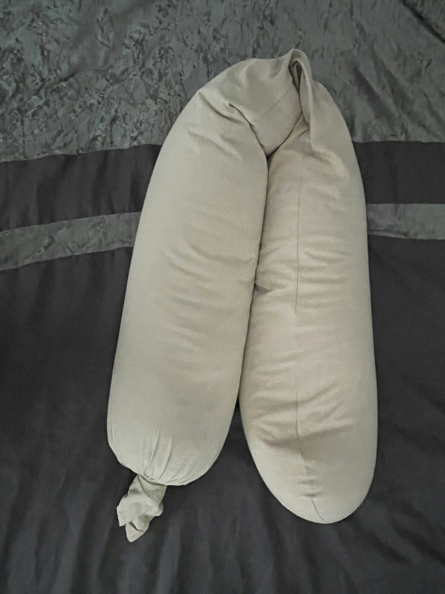 A Najell pregnancy pillow folded in half