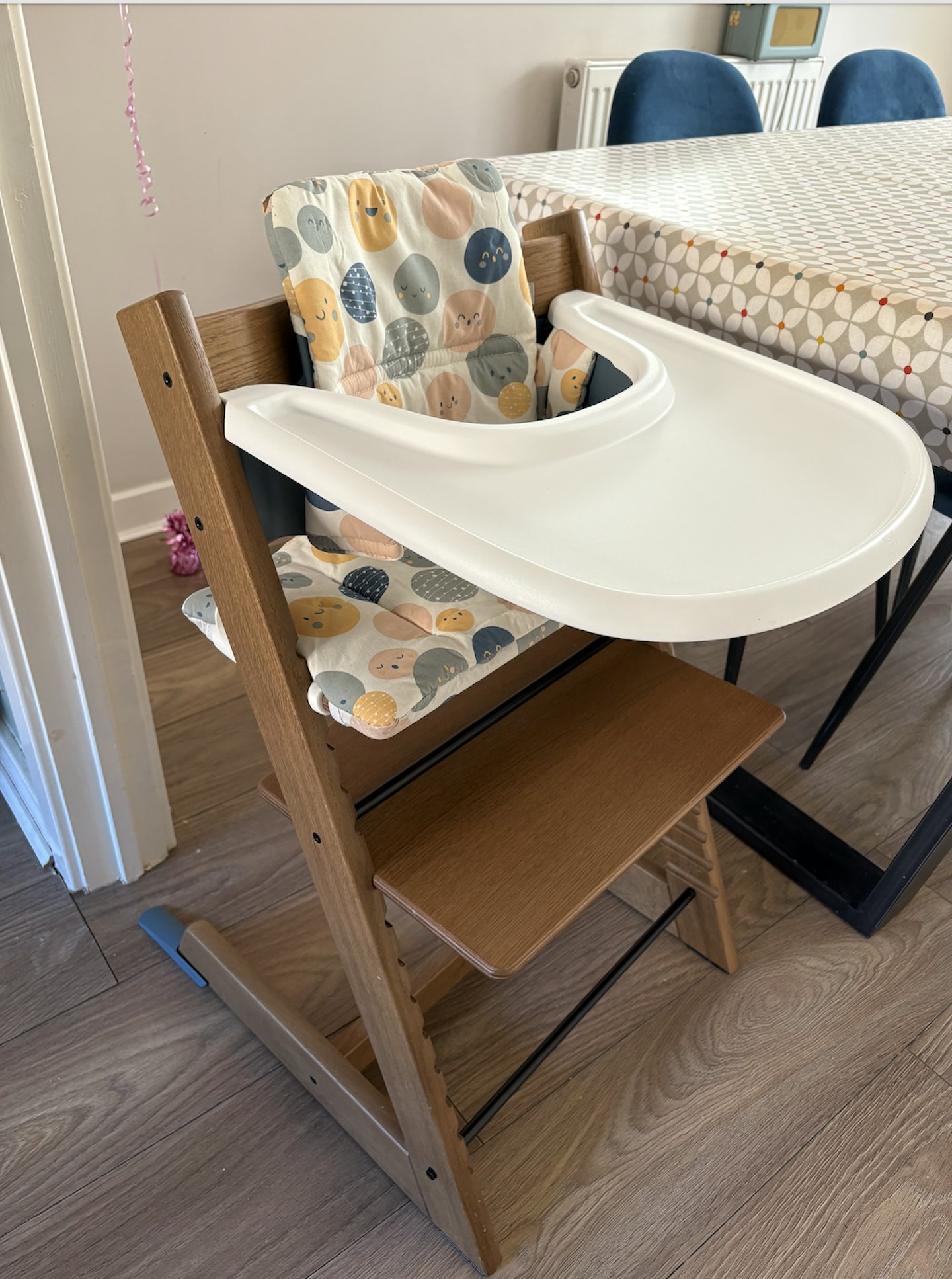 the stokke tripp trapp high chair in a kitchen
