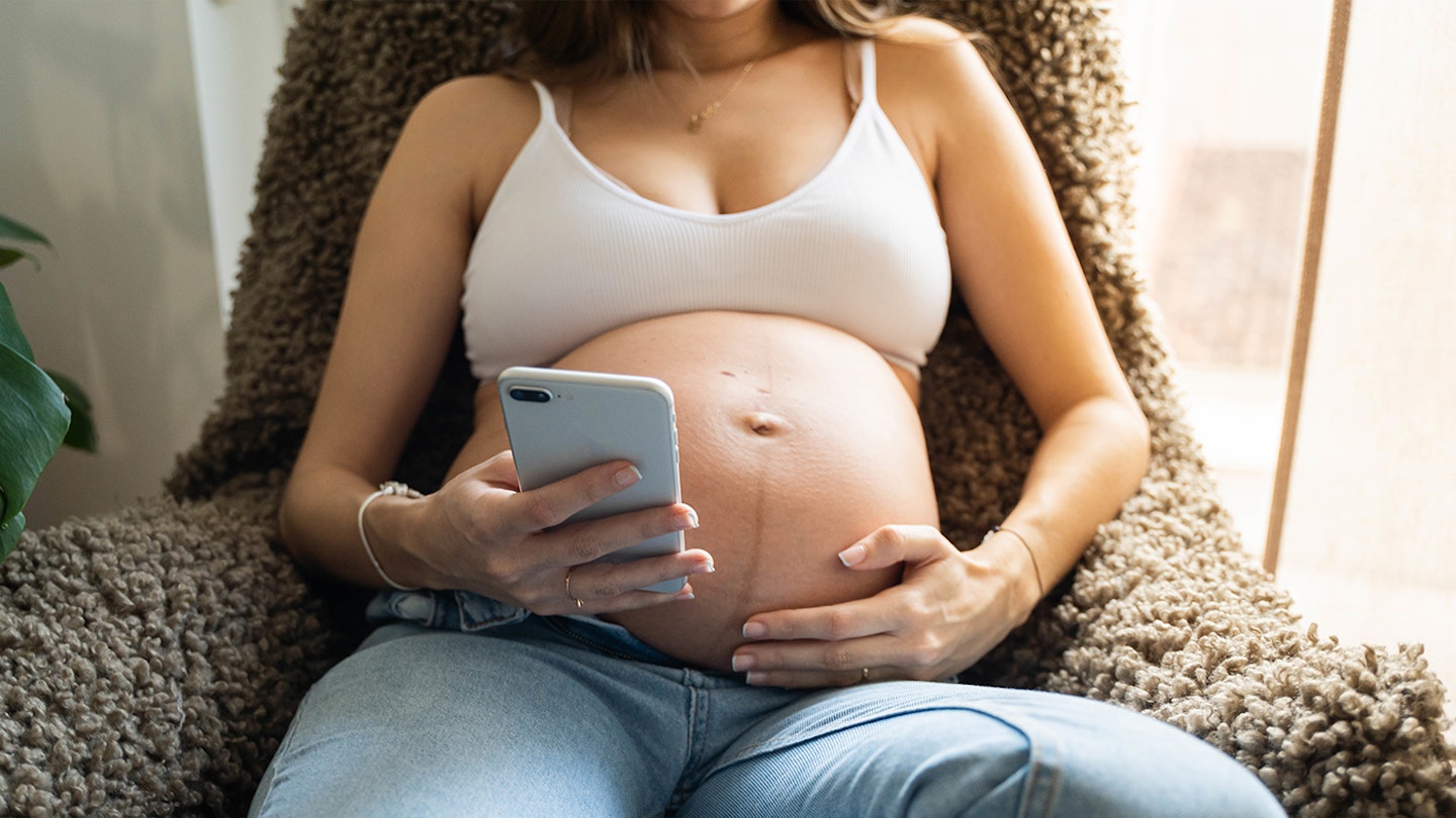 pregnant woman with phone