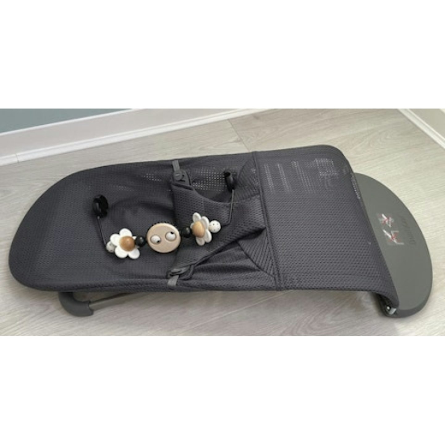 Dark grey baby bouncer folded
