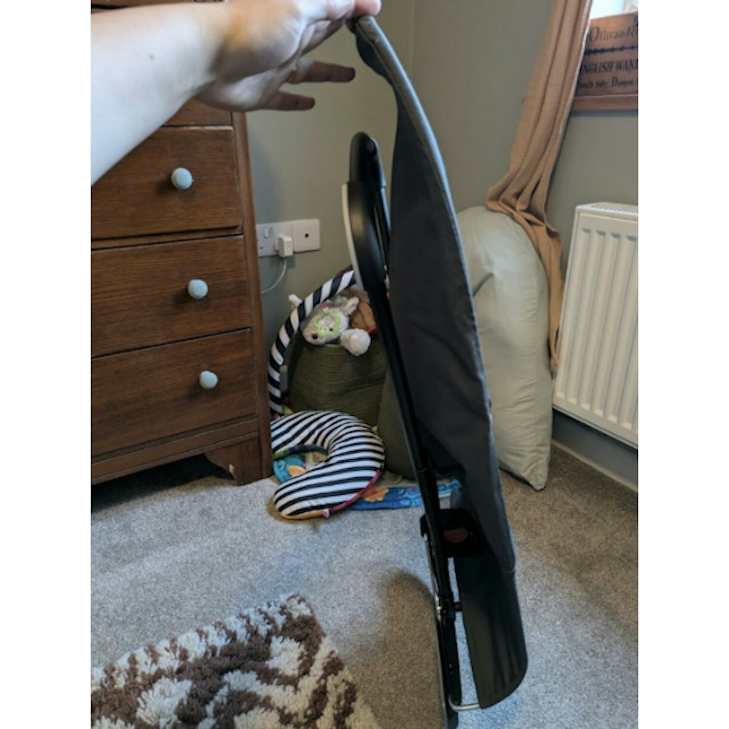 side view of folded baby bouncer