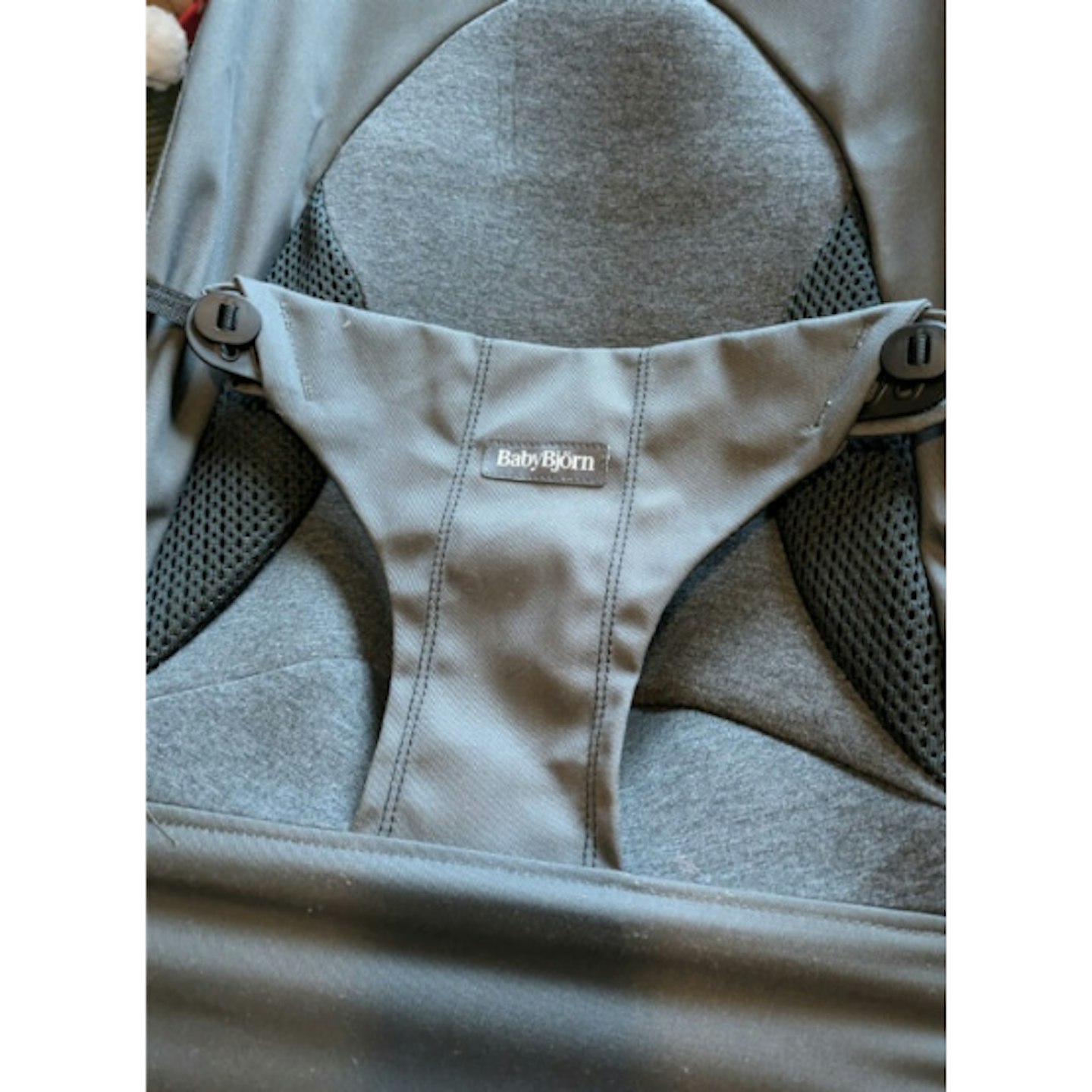 Close up of grey baby bouncer